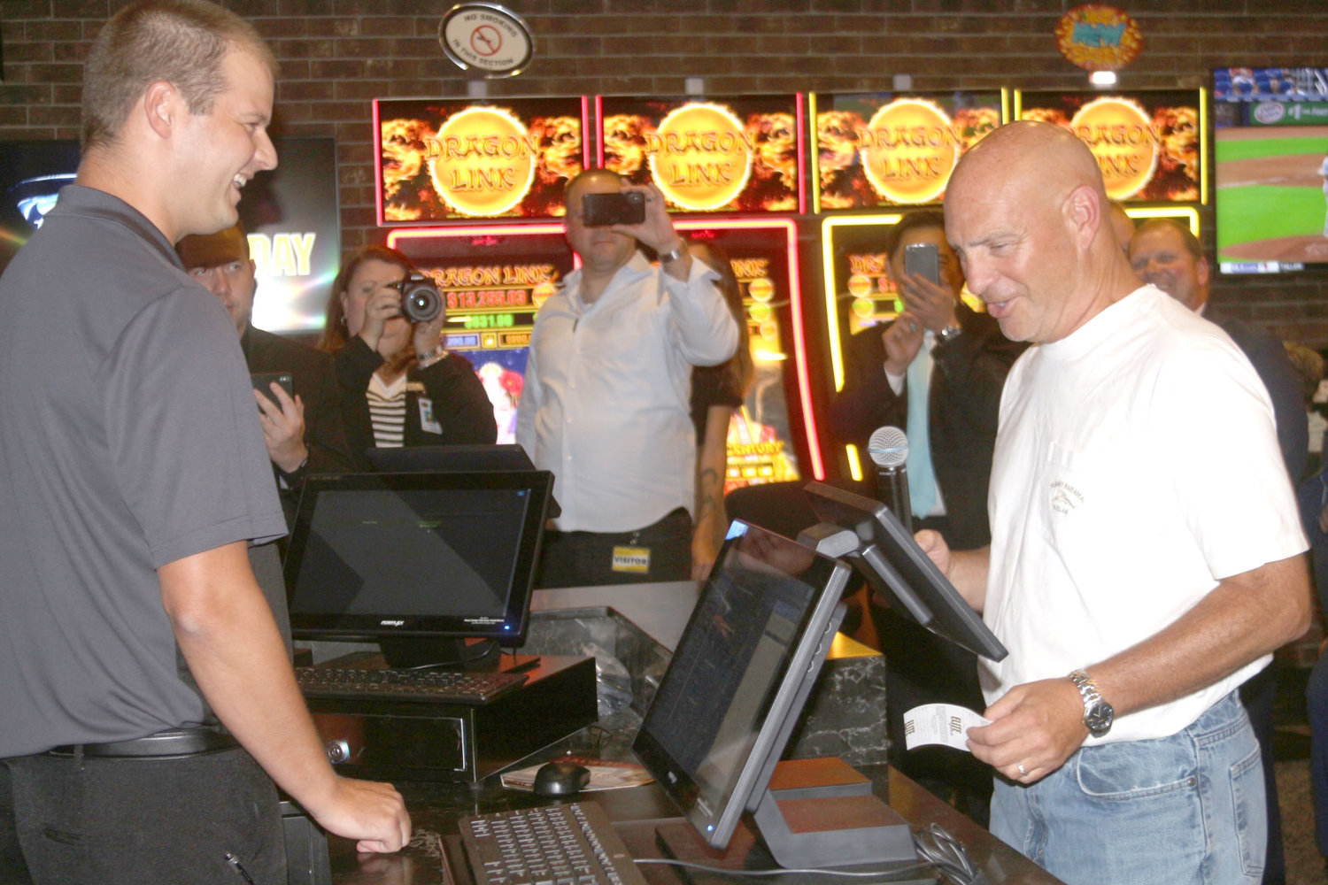 State Rep. Dave Jacoby, D-District 74, places a $20 bet on the Chicago Cubs at the Aug. 15 grand opening of the Elite Sportsbook at Riverside Casino and Golf Resort.