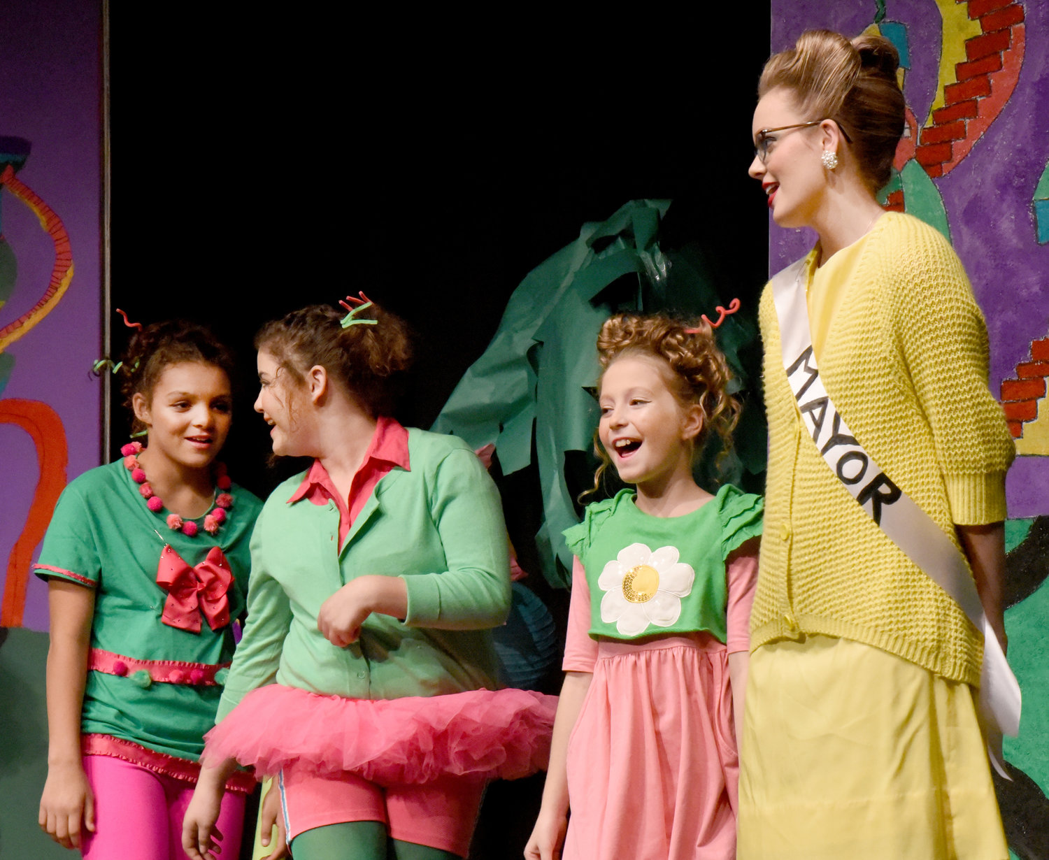 Whoville Mayor Skylar Smith sings with the Whos during the Lone Tree High School production of Seussical.