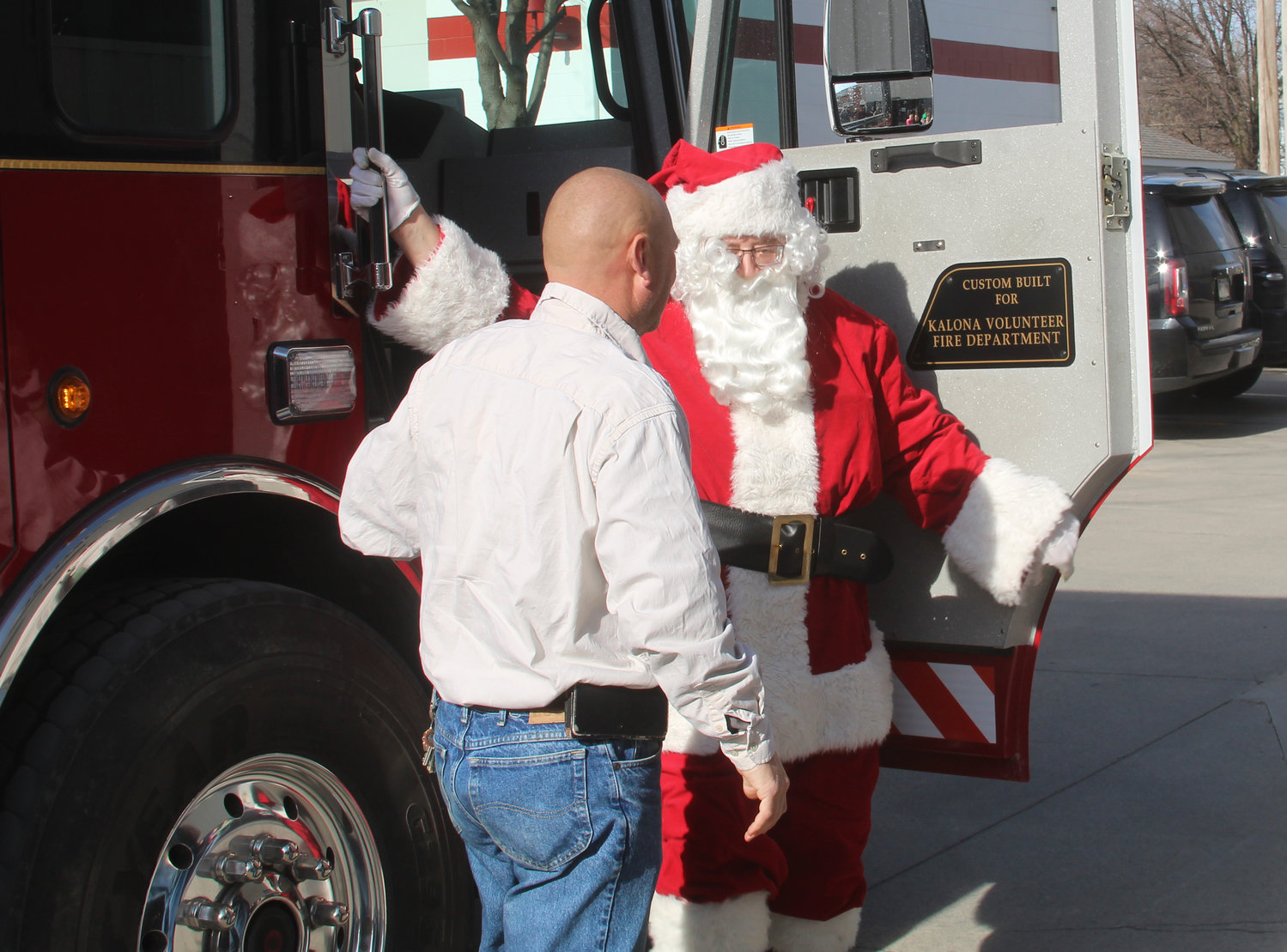 Santa Claus arrives at the Kalona Community Center by firetruck on Dec. 7.