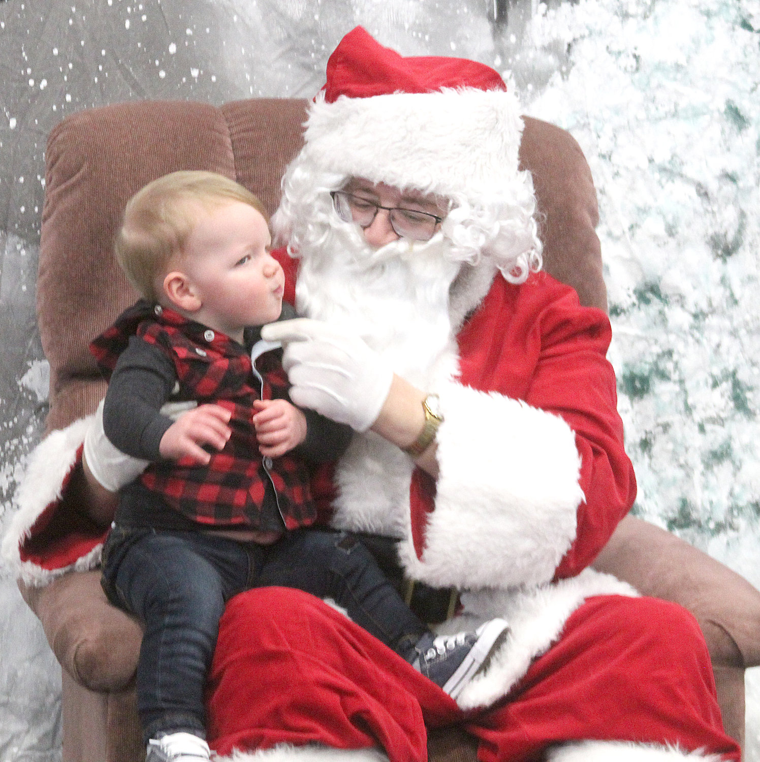Mason Freel visits with Santa Claus at the Kalona Community Center on Dec. 7.