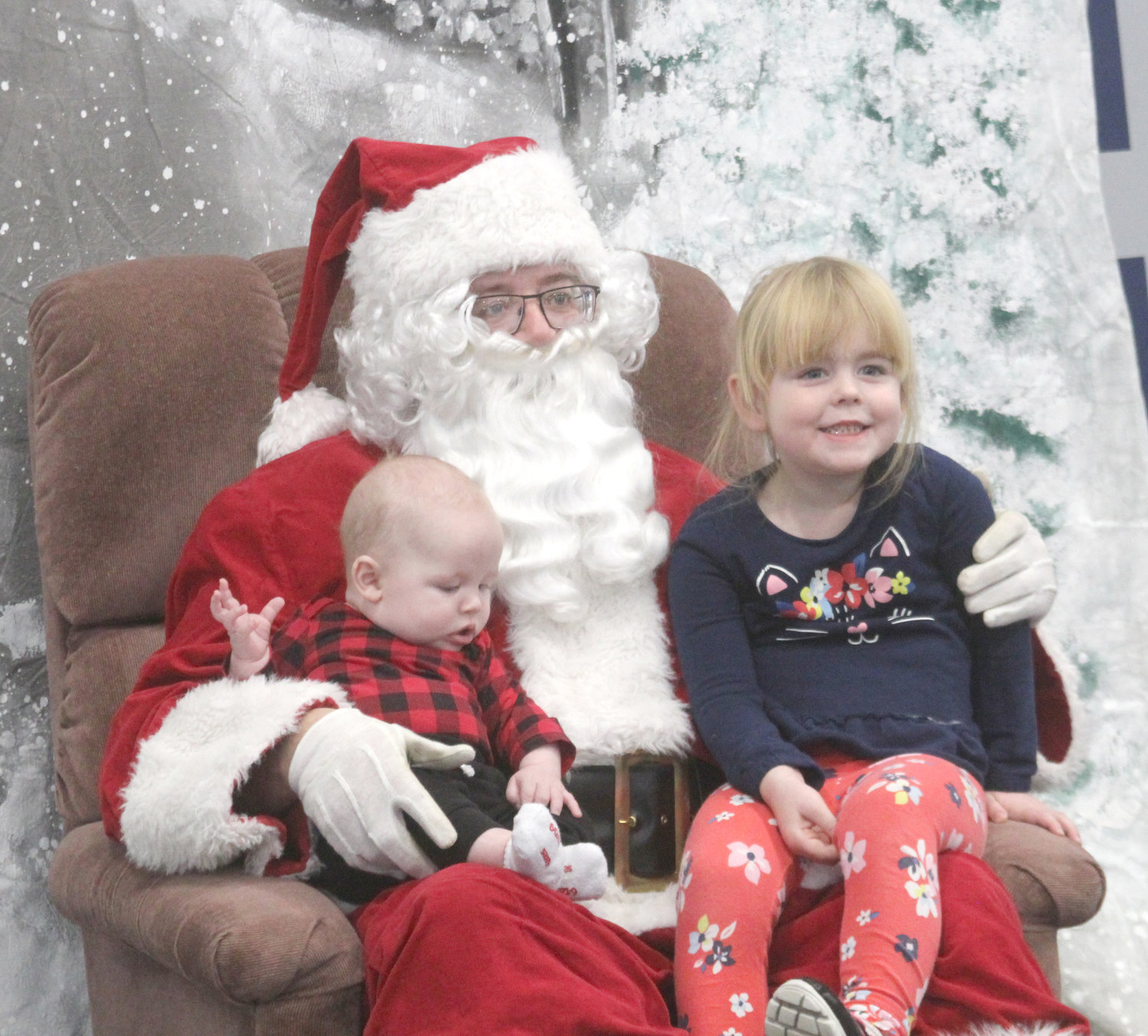 Anthony and Hope Peterson visit with Santa at the Kalona Community Center on Dec. 7.