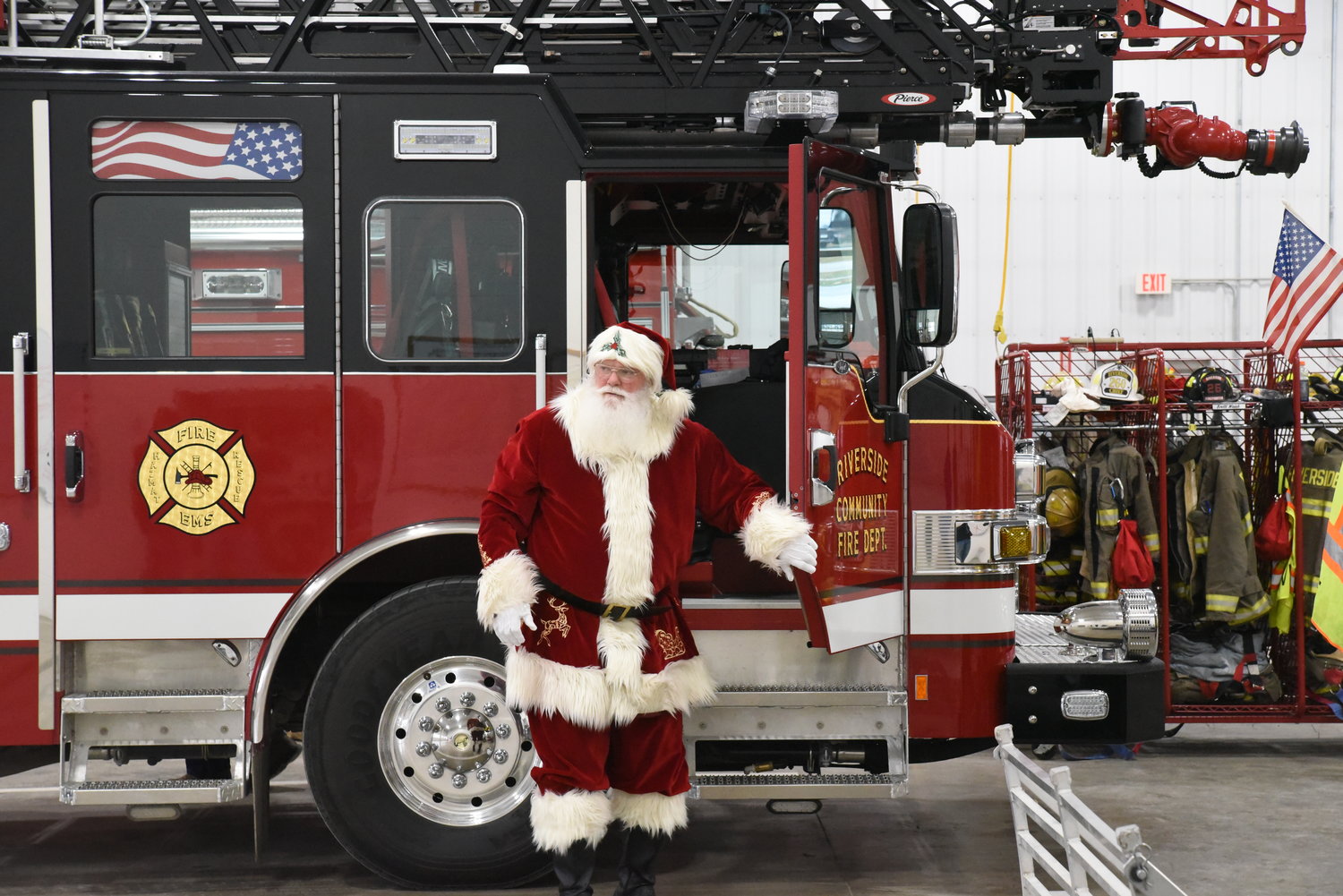 Santa skipped the sleigh and rode in a Riverside Fire Department truck to get to the fire station where he was greeted by dozens of children.
