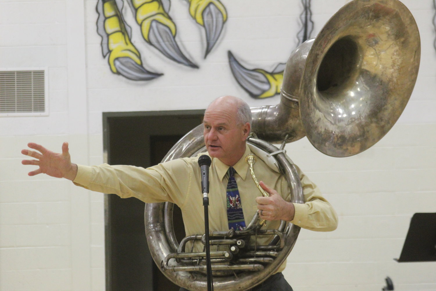 Mid-Prairie fifth and sixth grade band instructor Norman Brooks accompanies the seventh- and eighth-grade band on his sousaphone at the Dec. 12 holiday concert.