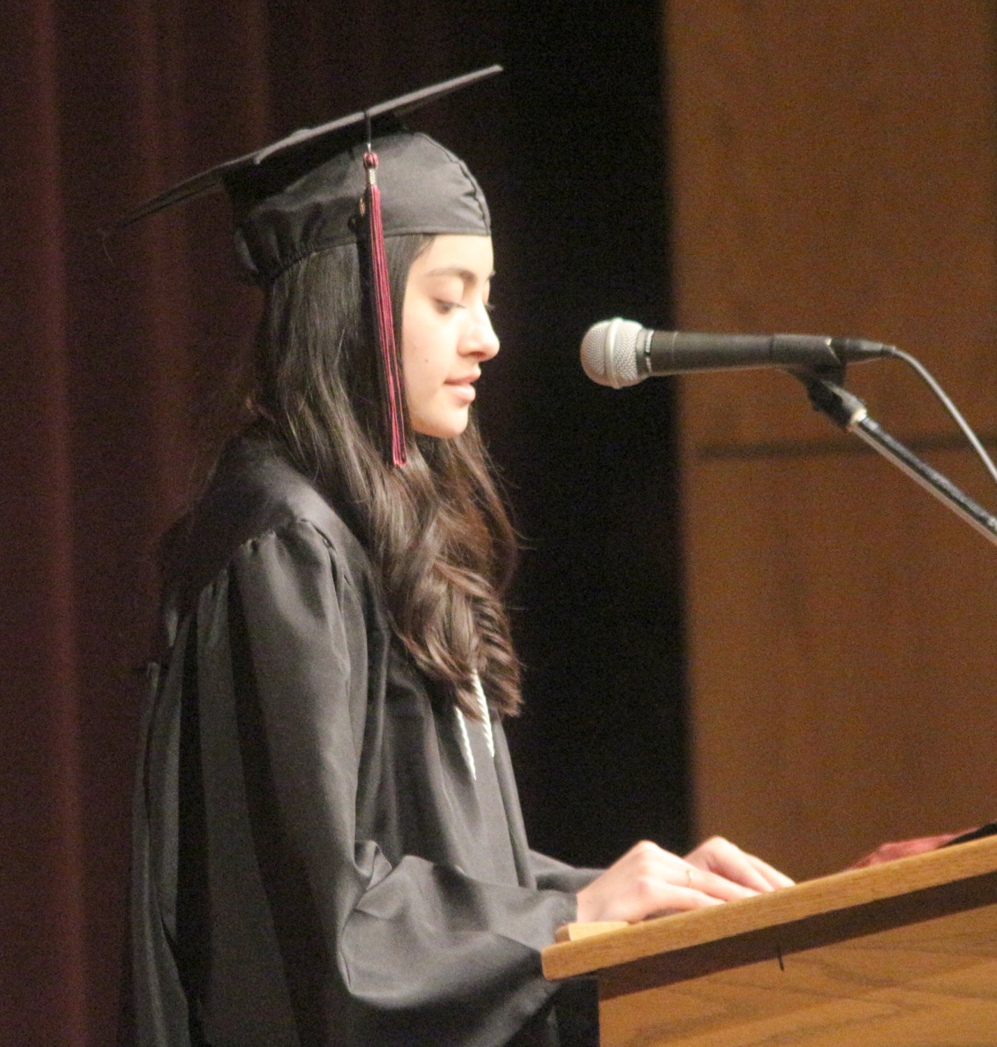 Yuli Montes de Oca speaks during the Hillcrest Academy commencement ceremony.