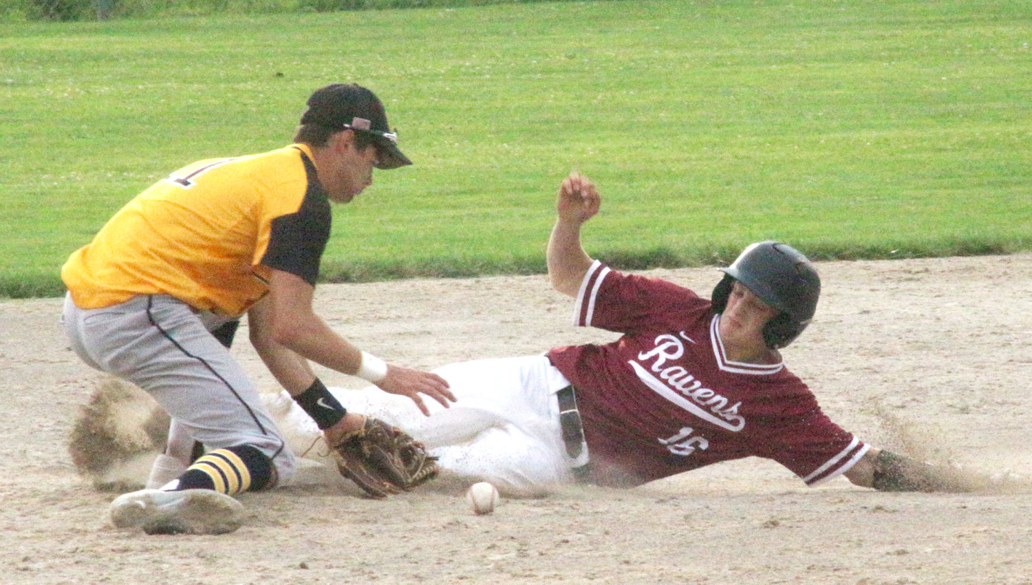 Hillcrest Academy’s Drew Blauvelt slides safely into second base during their June 26 game against Louisa-Muscatine.