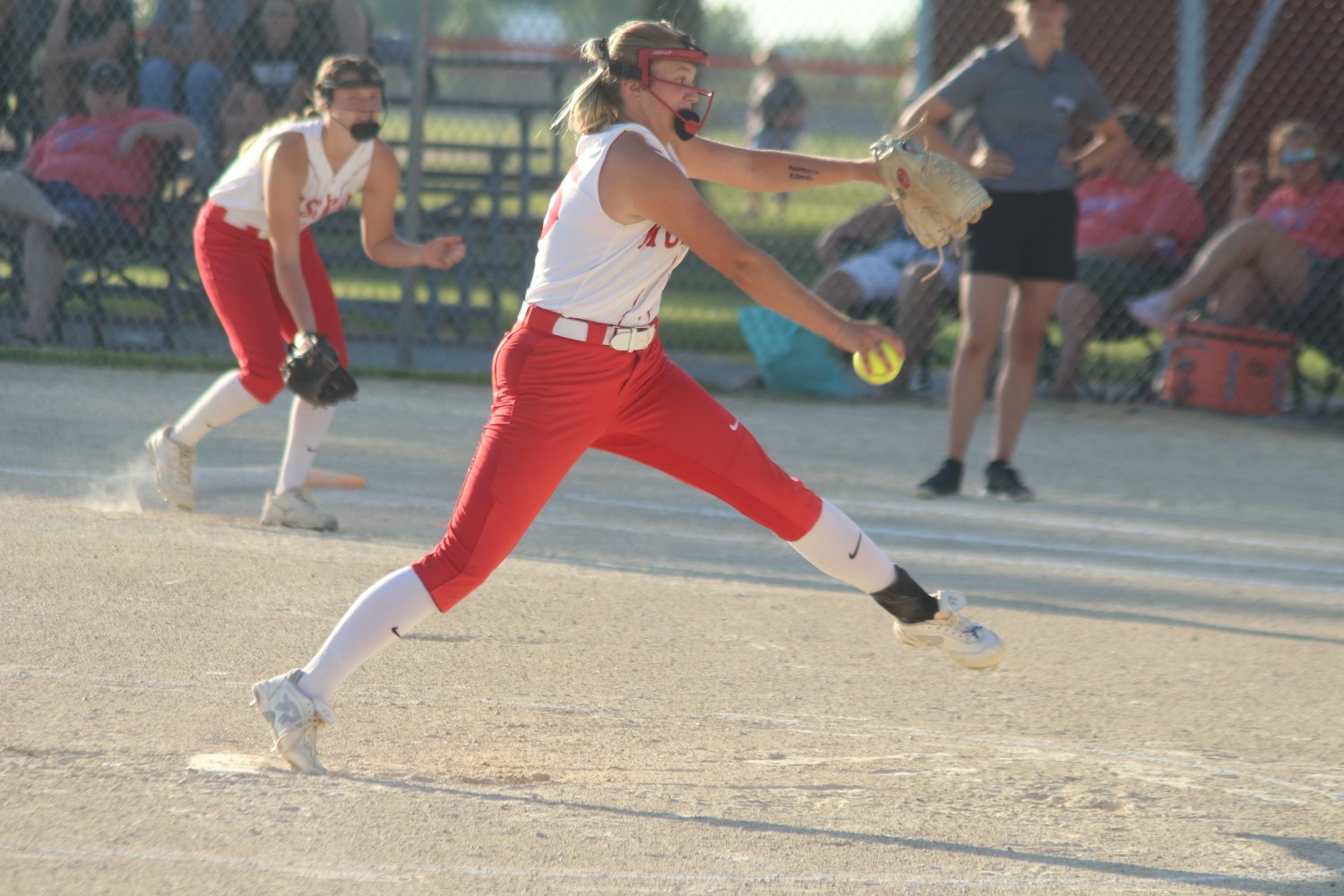 Highland sophomore Grace Batcheller sends a pitch on its way in Monday’s game against Hillcrest.