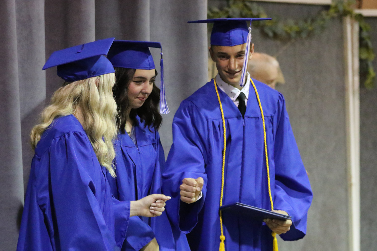 Mariah Miller and Jamison Stutzman share a post-graduation first bump during Pathway Christian School's graduation ceremony on May 16, 2021.