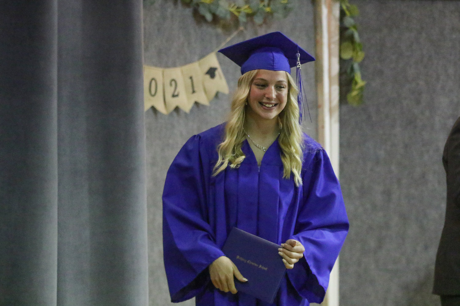 Mariah Miller walks across the stage with her diploma during Pathway Christian School's graduation ceremony on May 16, 2021.