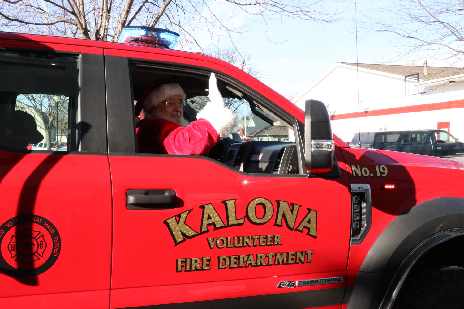 Kalona Volunteer Fire Department gives Santa a ride.