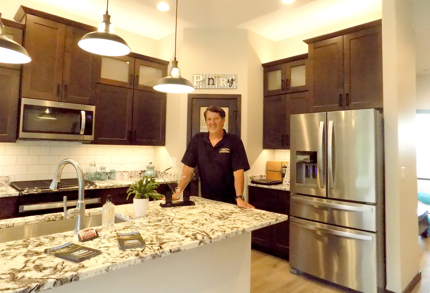 Jeremy Statler inside the kitchen of Statler Construction’s award-winning model home