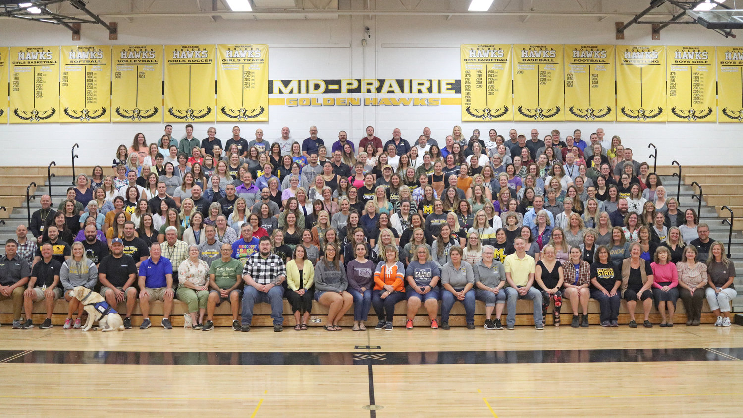 Mid-Prairie’s full staff assembles in the gym before the start of a new school year.