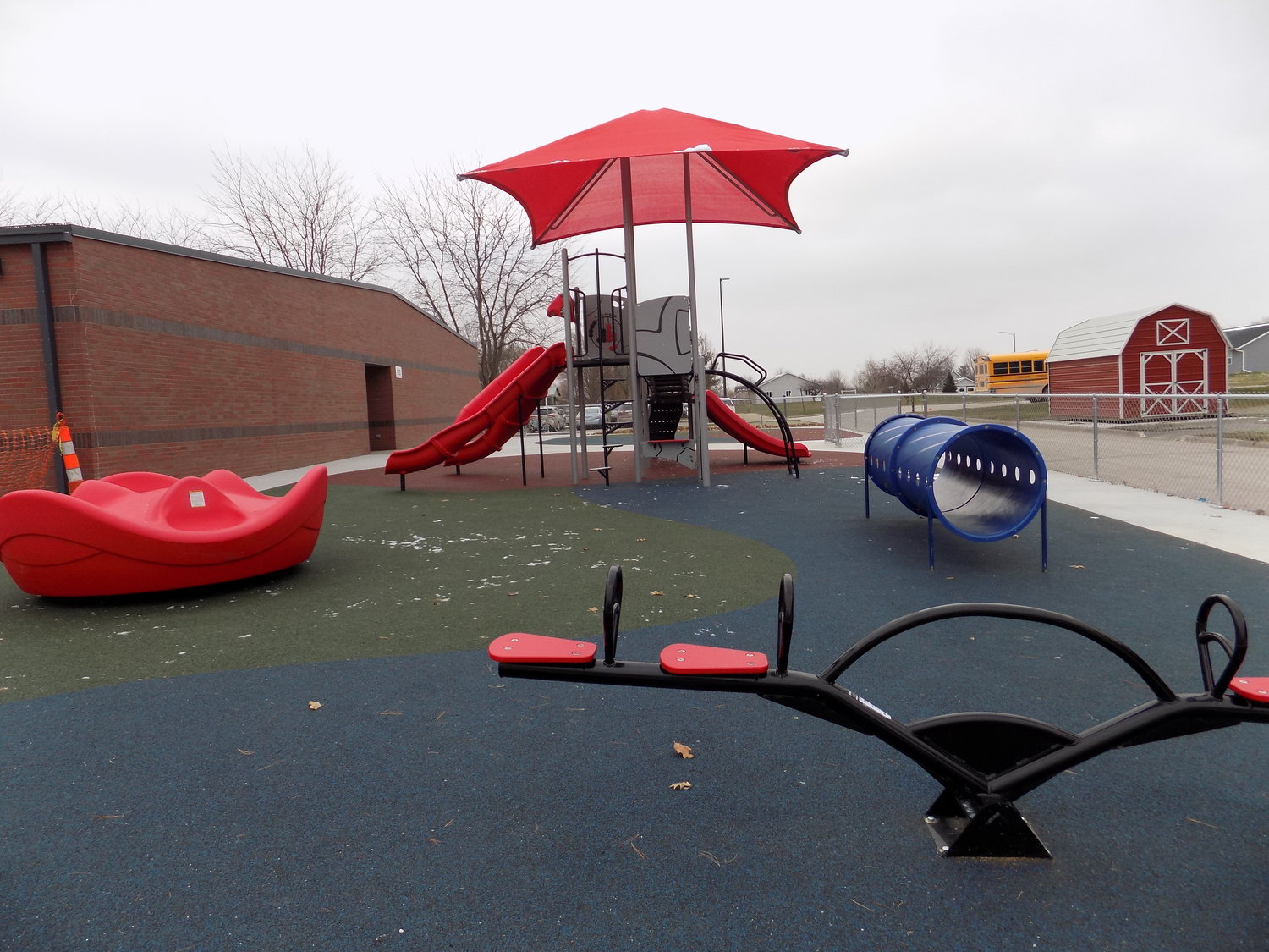 Colorful new equipment with a soft surface underfoot invites students to enjoy an active recess.