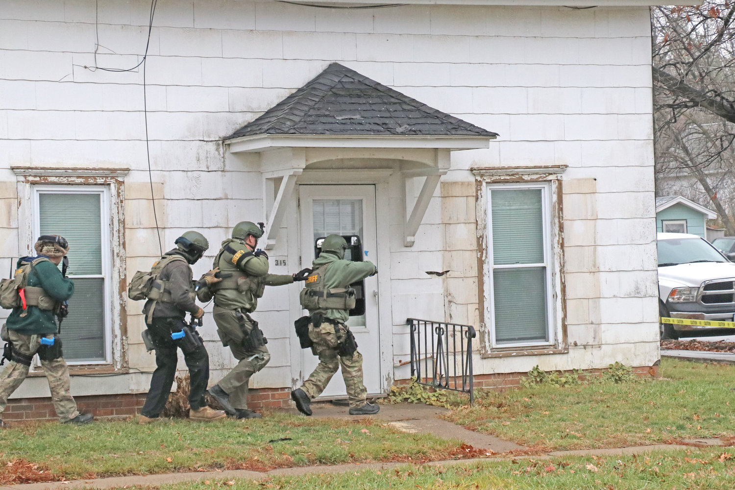 A local SWAT team practices breaching an entryway on Nov. 15.