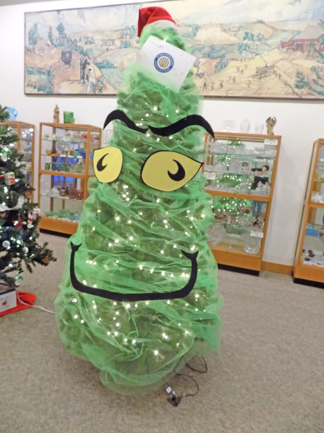 Kalona Optimists had fun with a Grinch theme at the Christmas Tree Walk.