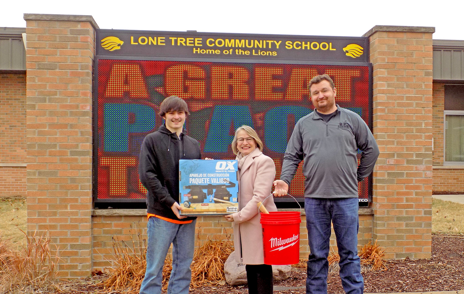 Lone Tree student Caden Smith was presented with a set of tools by Representative Mariannette Miller-Meeks and Gorden Viers, chairperson of the Iowa City Home Builders Association Parade of Homes on Jan. 18.