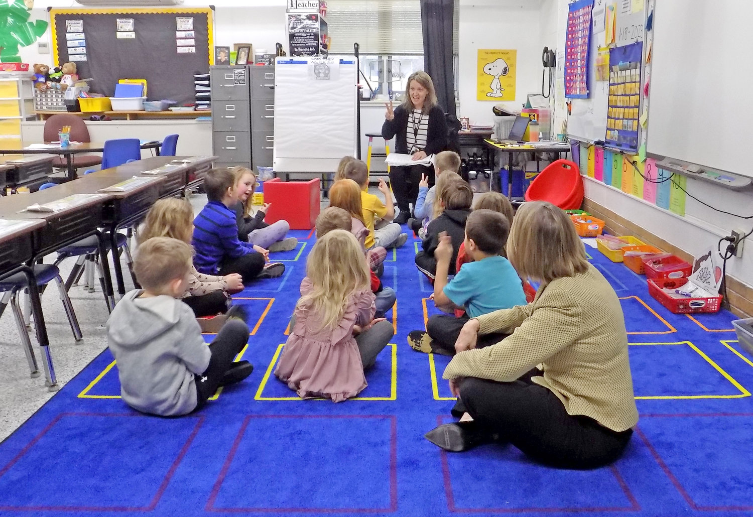 Rep. Miller-Meeks greeted every classroom on her tour of Lone Tree School; here, she learns to sound out words with Donda Nebergall’s kindergarten class.