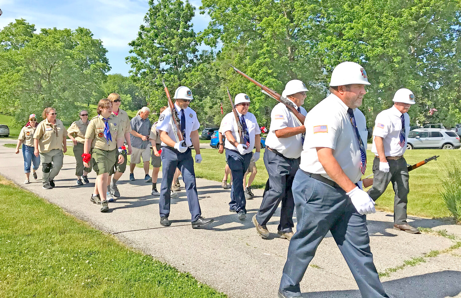 The Riverside VFW and Ladies Auxiliary members marching to the Riverside Cemetery.