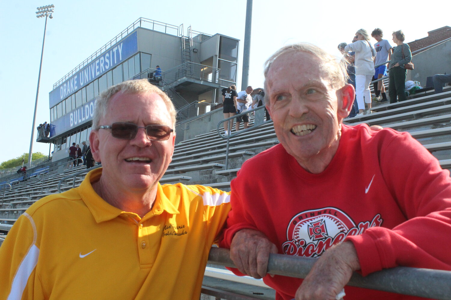 Mark Hostetler, Mid-Prairie's girls track and cross country coach, reuinites with Bill Kelly of Washburn, Illinois.